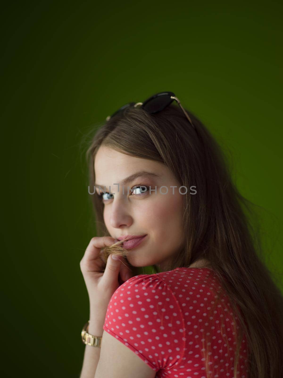 Portrait of beautiful young women isolated on a green background