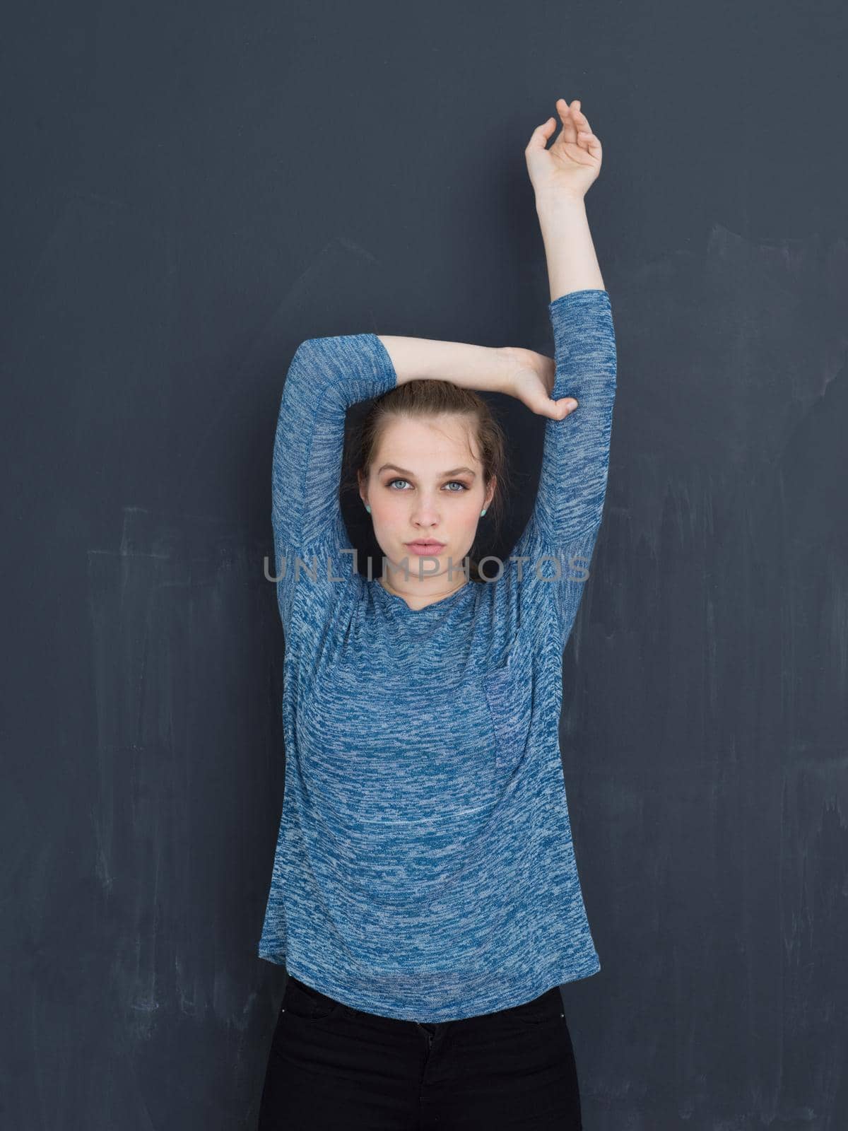 portrait of Beautiful young woman isolated on grey background