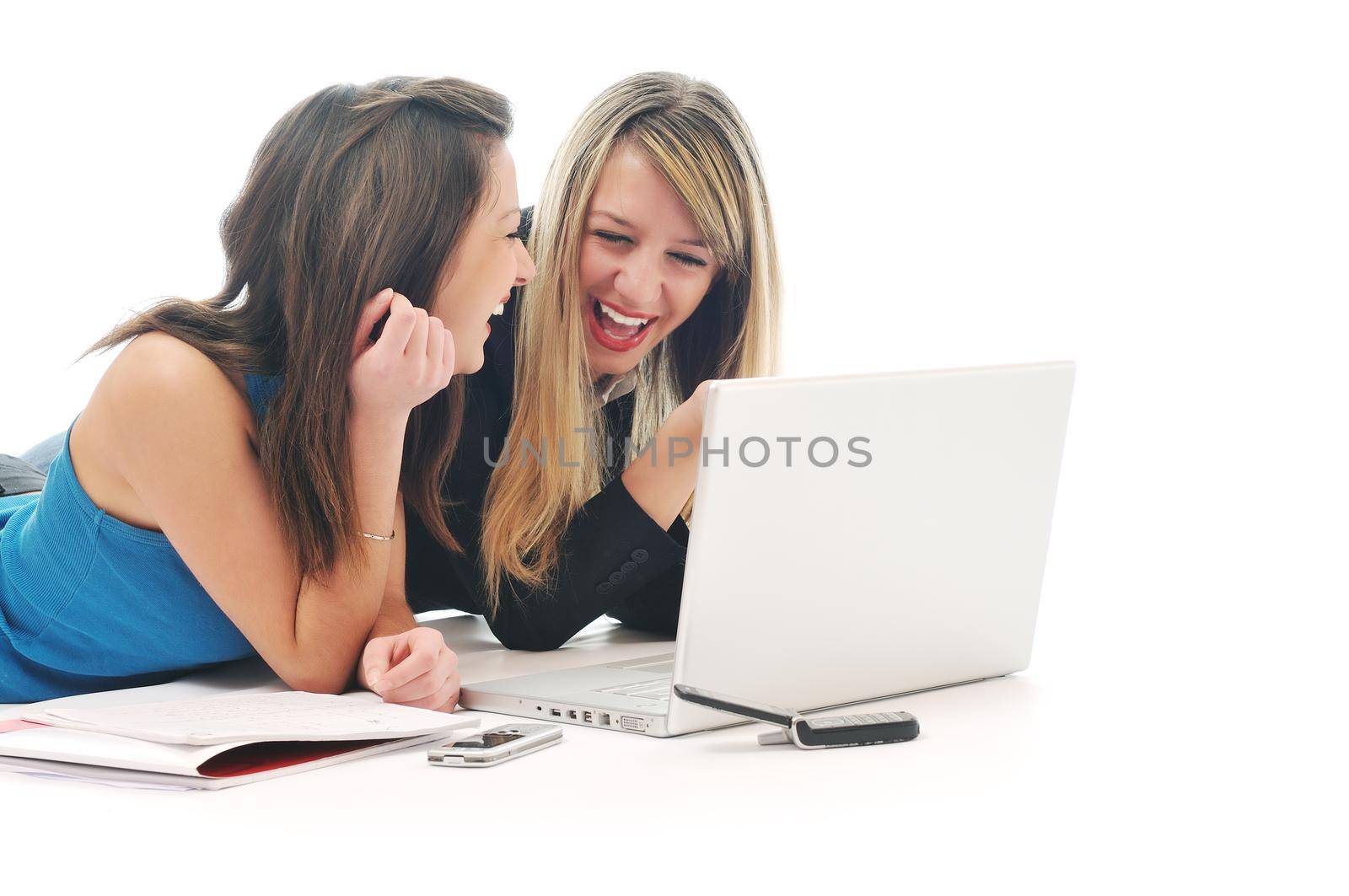 successful team two young happy  student girl work on laptop computer isolated on white