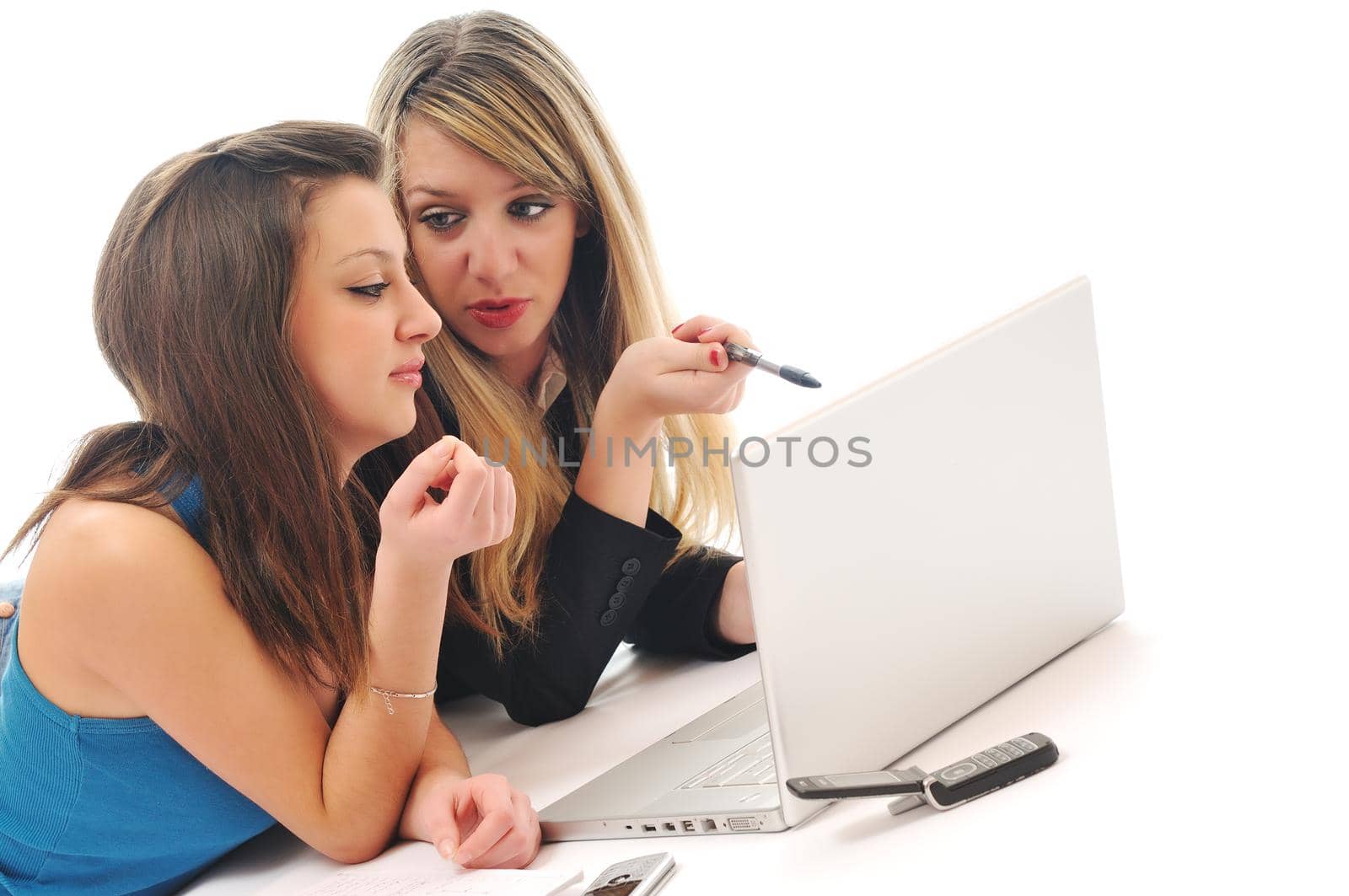successful team two young happy  student girl work on laptop computer isolated on white