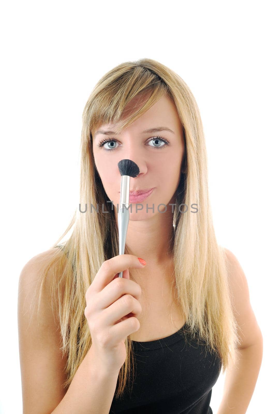 beautiful young woman apply powder makeup with brush isolated on white