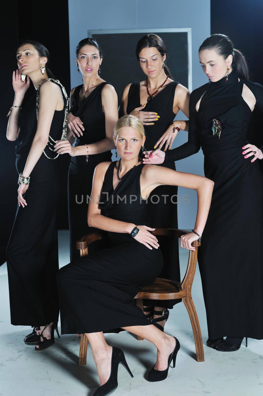 beautiful woman on fashion show piste with gold jawel