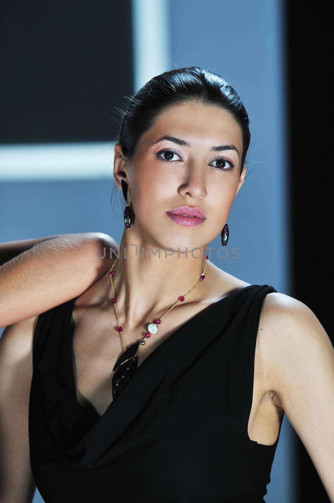 beautiful woman on fashion show piste with gold jawel