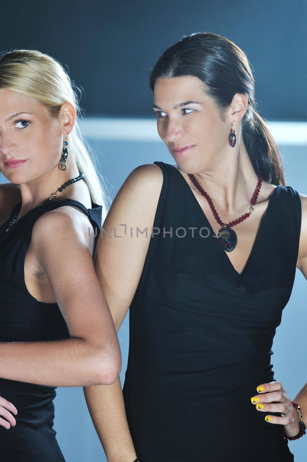 beautiful woman on fashion show piste with gold jawel