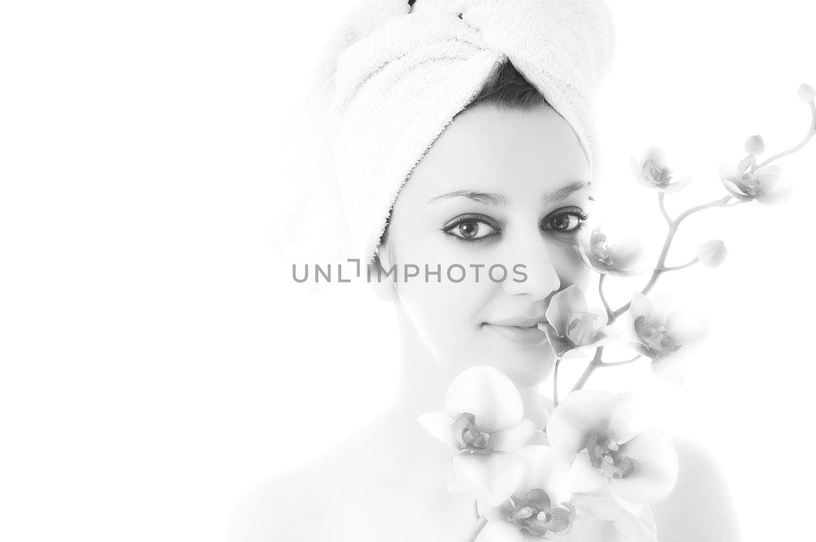 beauty halth and spa wellness isolated young woman face portrait closeup with towel and flower treatment