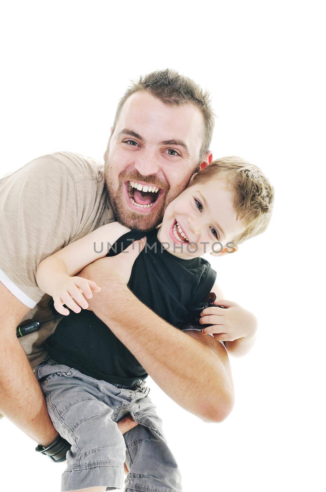 happy father and son play isolated on white in studio