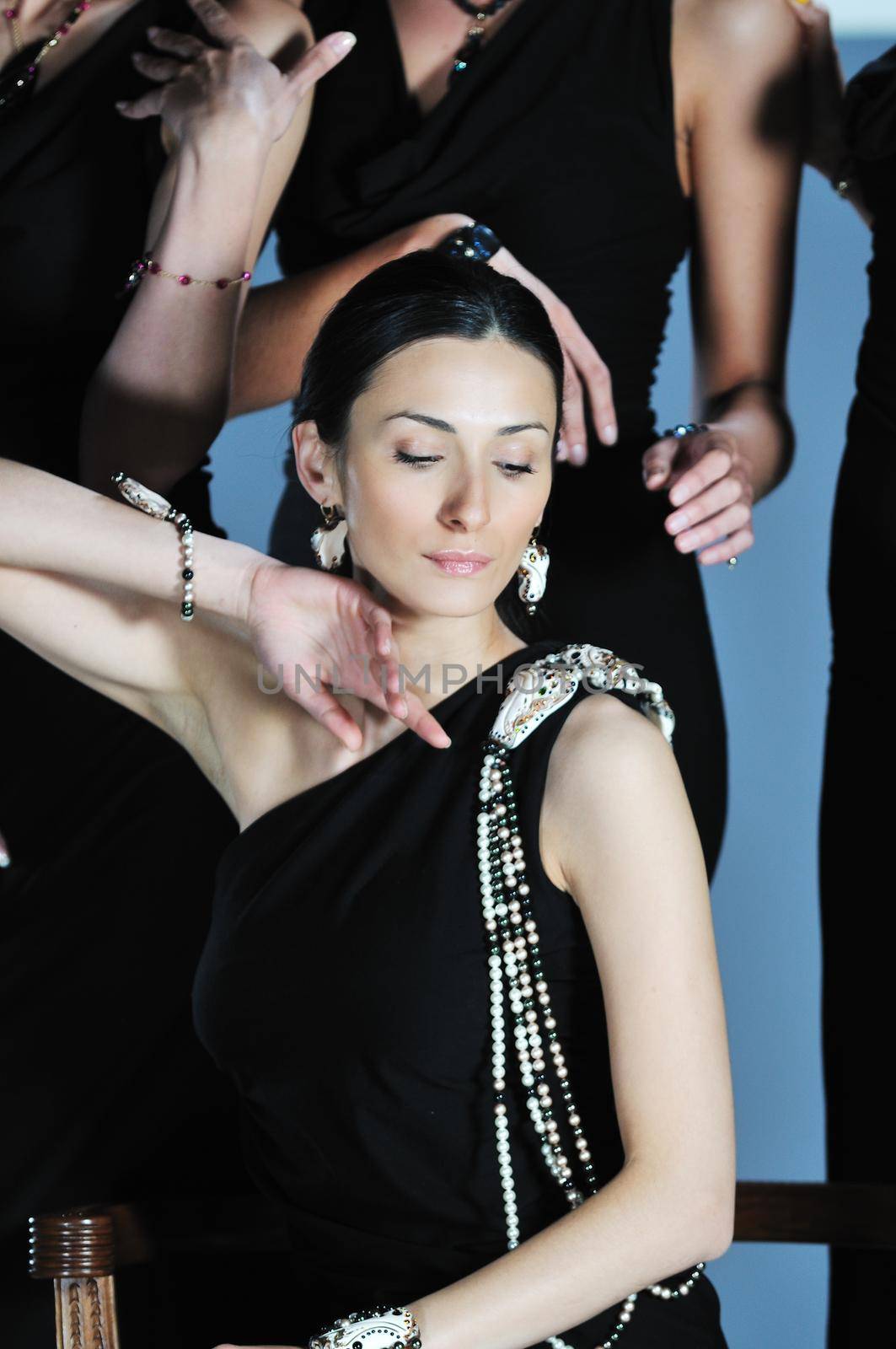 beautiful woman on fashion show piste with gold jawel