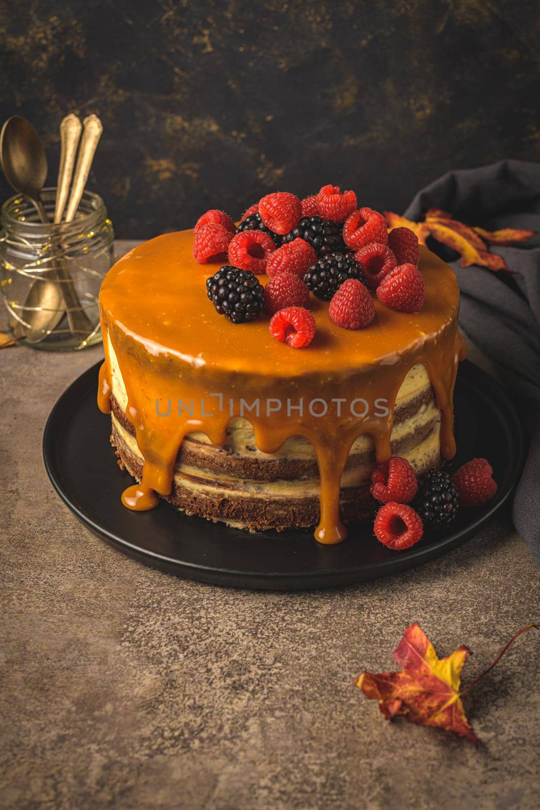 Delicious caramel cake with blackberries and raspberries.