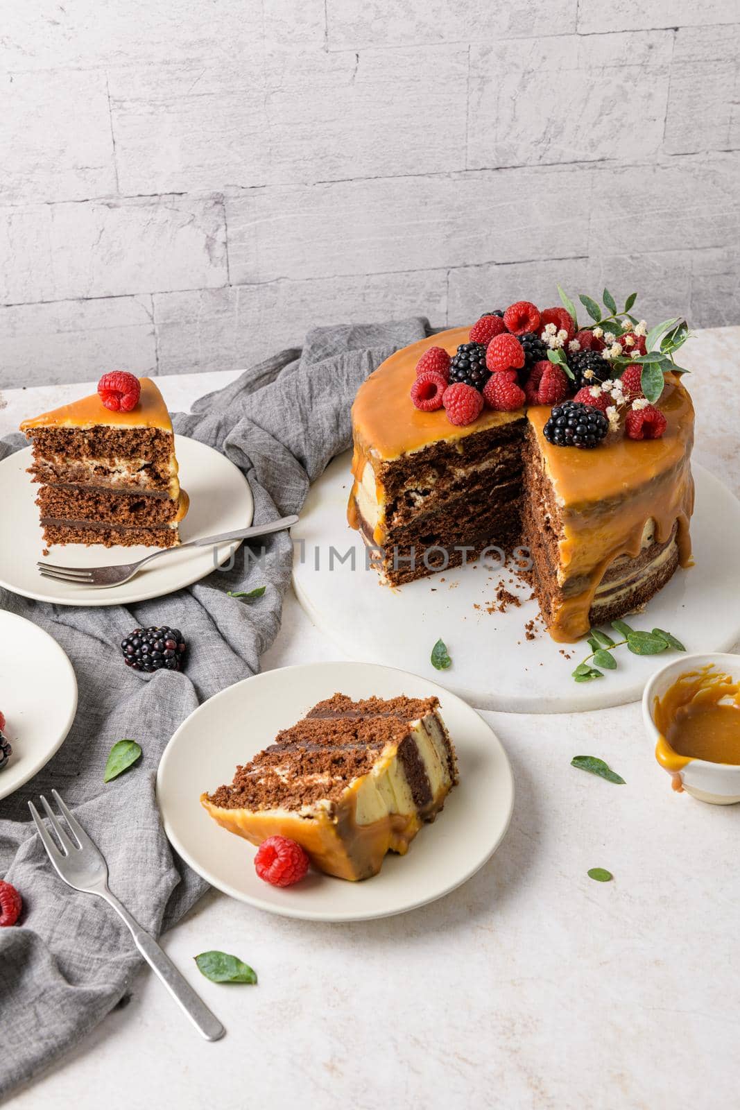 Delicious caramel cake with blackberries and raspberries.