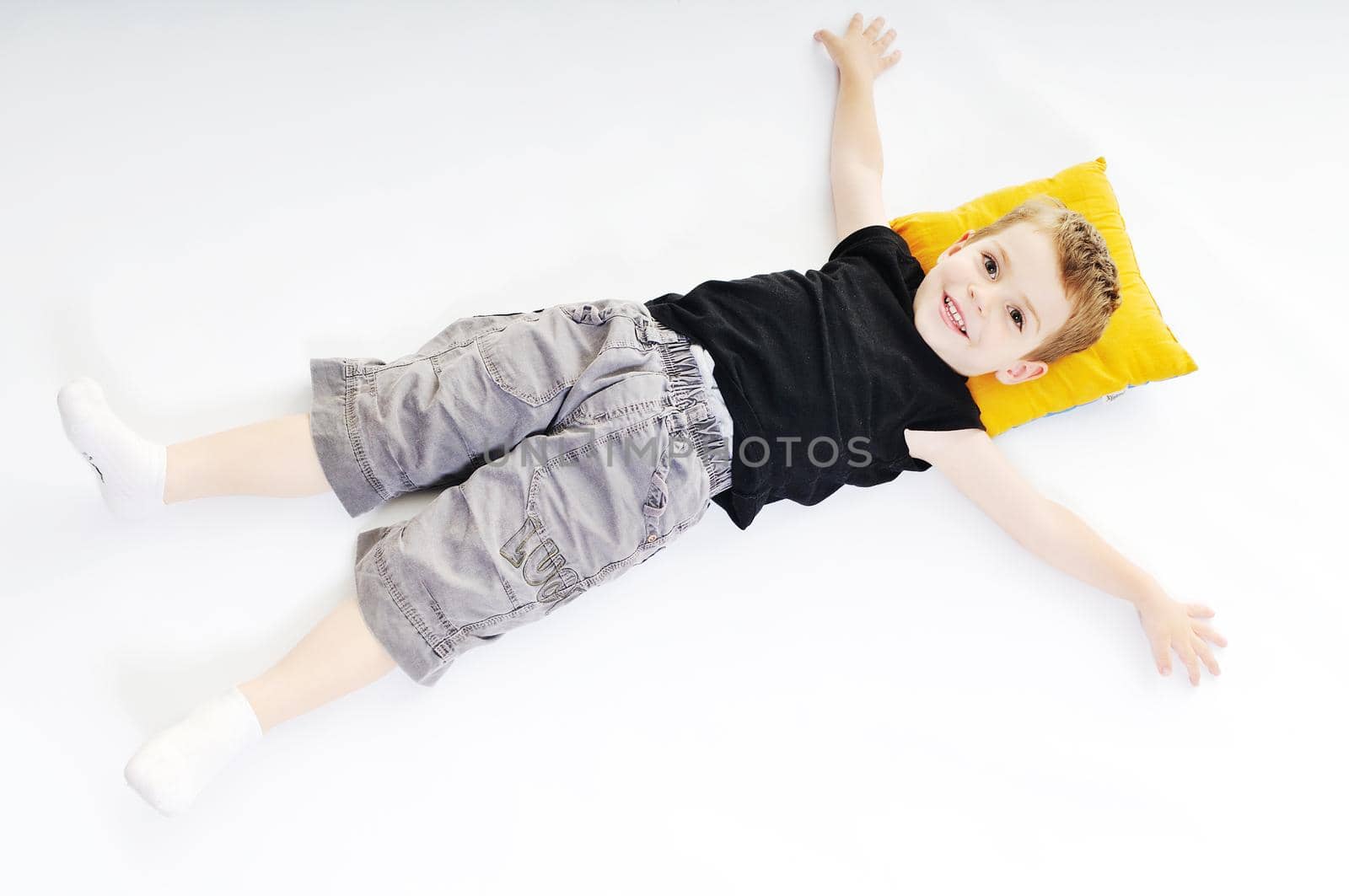 happy kid play on floor isolated on white