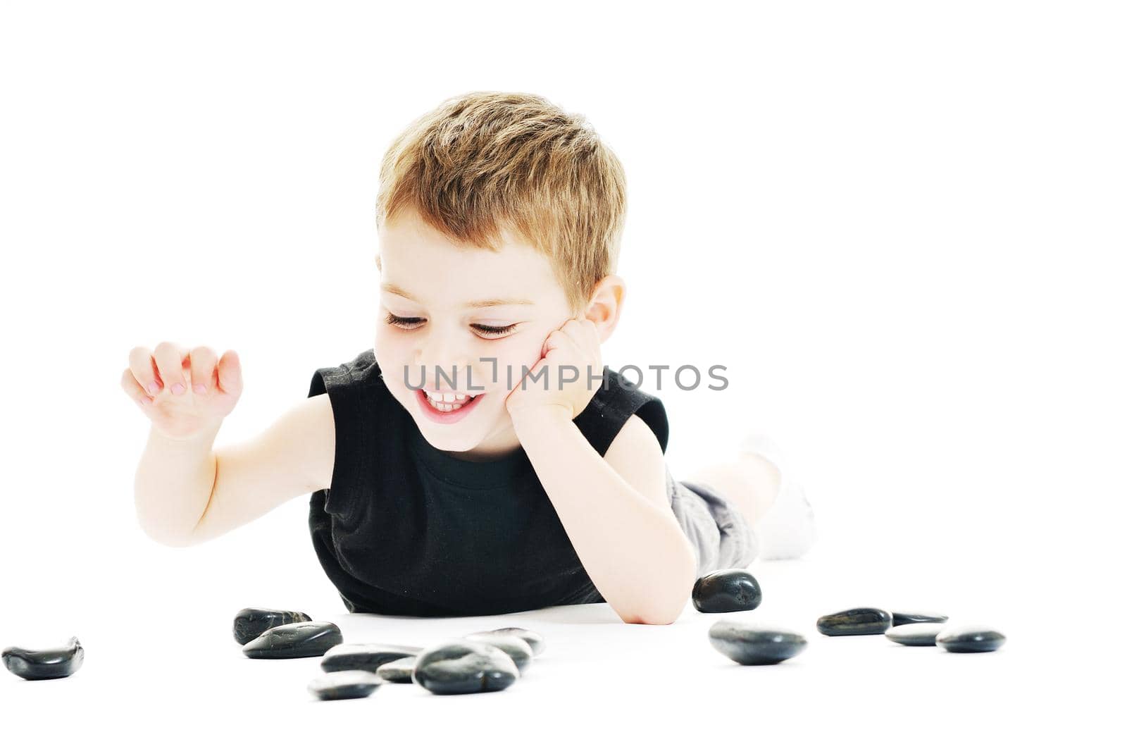 happy kid play on floor isolated on white