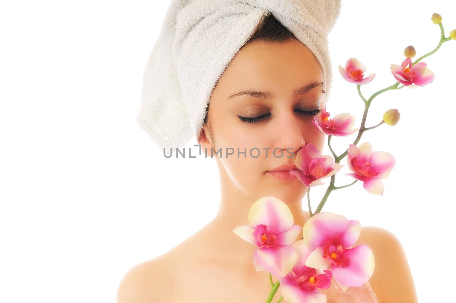 beauty halth and spa wellness isolated young woman face portrait closeup with towel and flower treatment