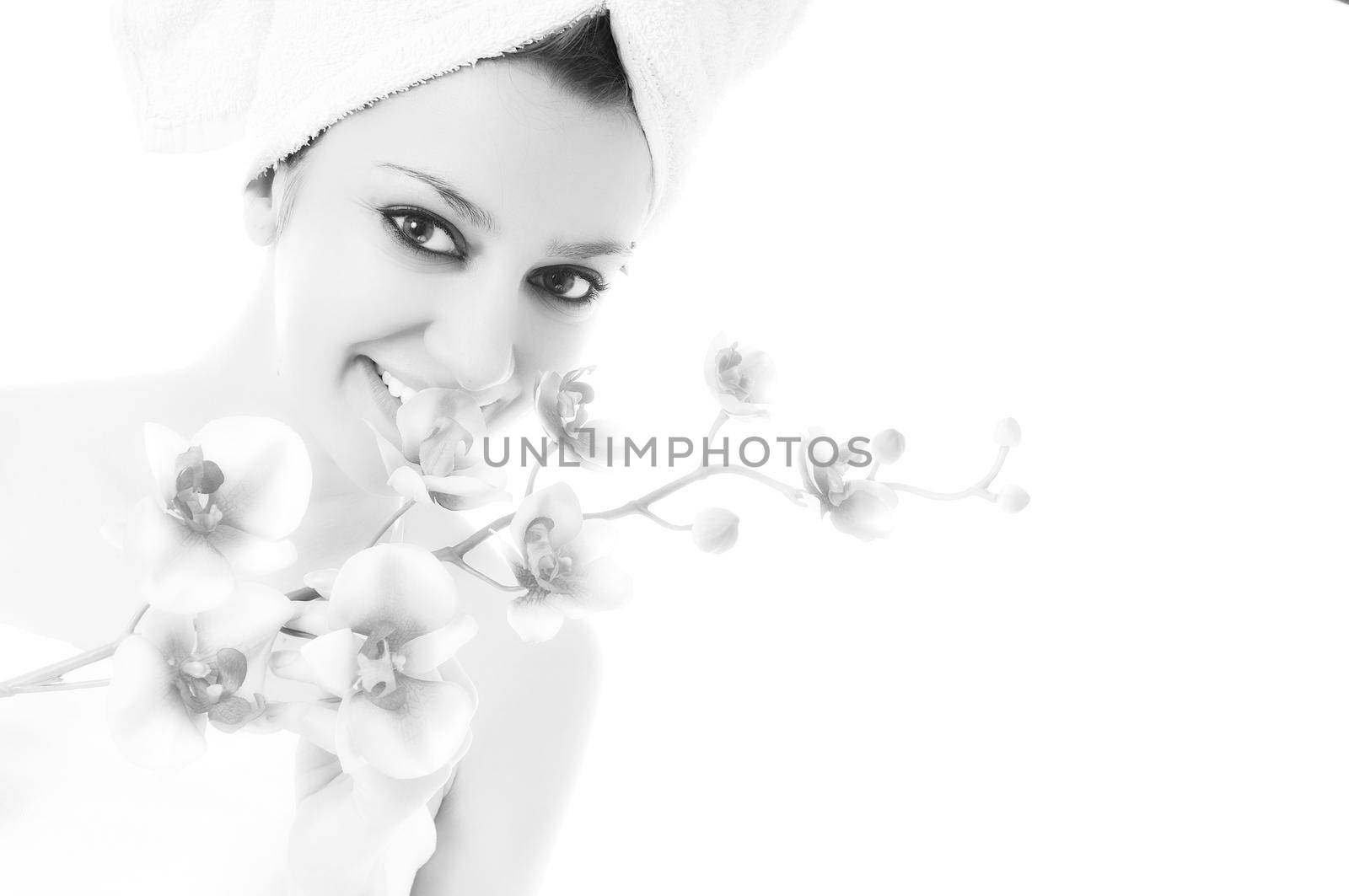 beauty halth and spa wellness isolated young woman face portrait closeup with towel and flower treatment