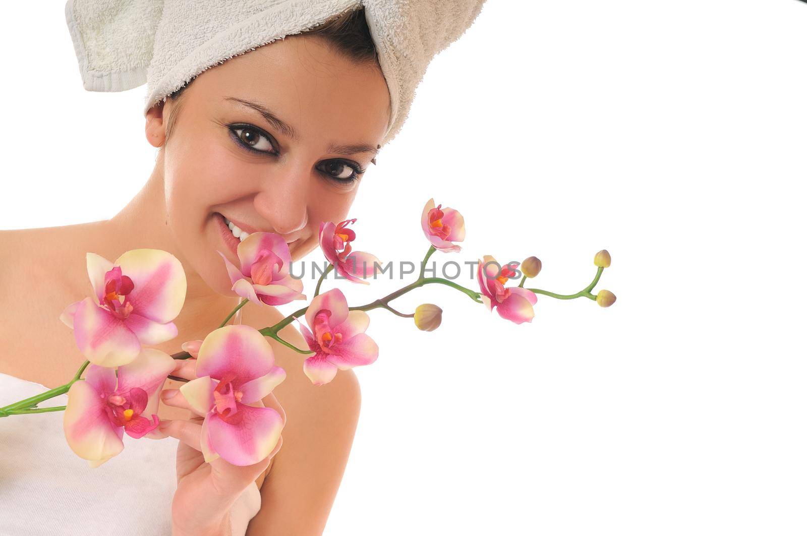 beauty halth and spa wellness isolated young woman face portrait closeup with towel and flower treatment