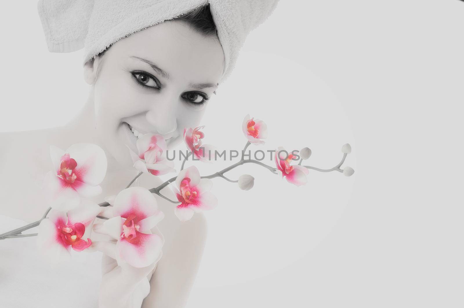 beauty halth and spa wellness isolated young woman face portrait closeup with towel and flower treatment