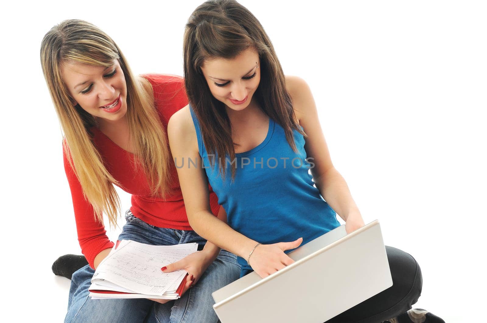 successful team two young happy  student girl work on laptop computer isolated on white