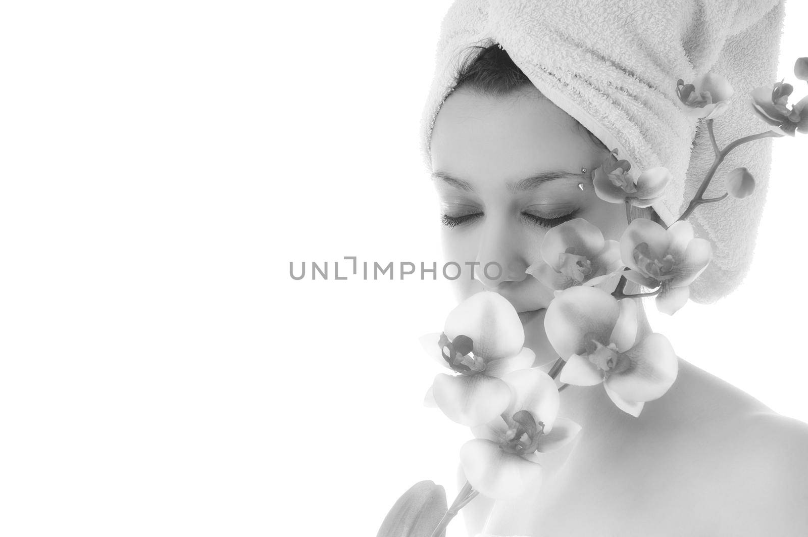 beauty halth and spa wellness isolated young woman face portrait closeup with towel and flower treatment