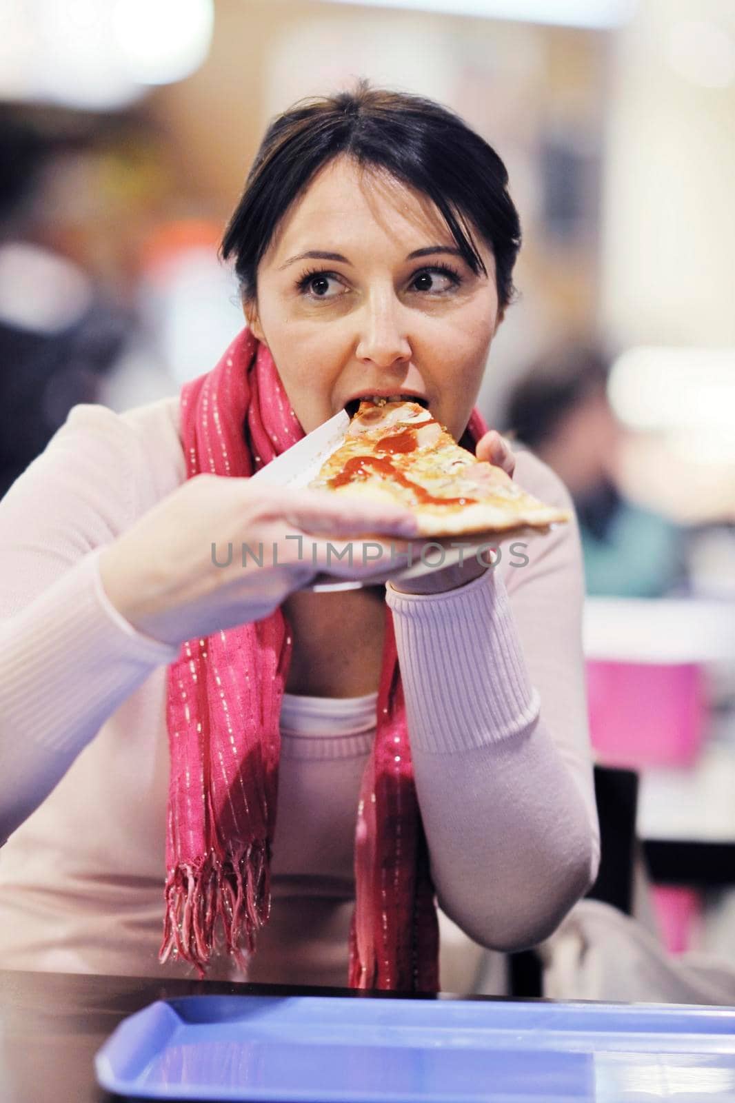 portrait of young woman eat pizza food at restaurant