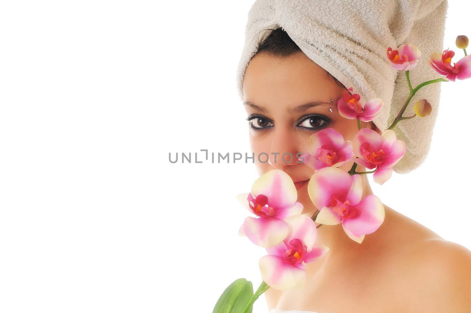 beauty halth and spa wellness isolated young woman face portrait closeup with towel and flower treatment