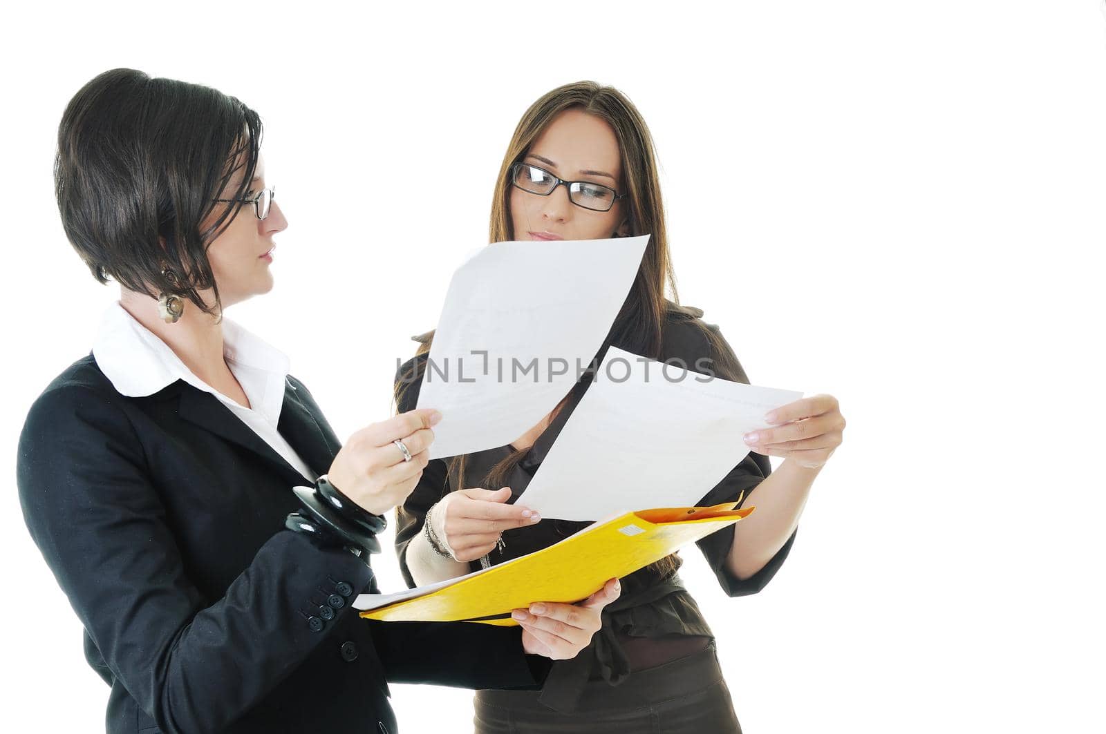 two young business woman group looking documents and giving advice and consultation