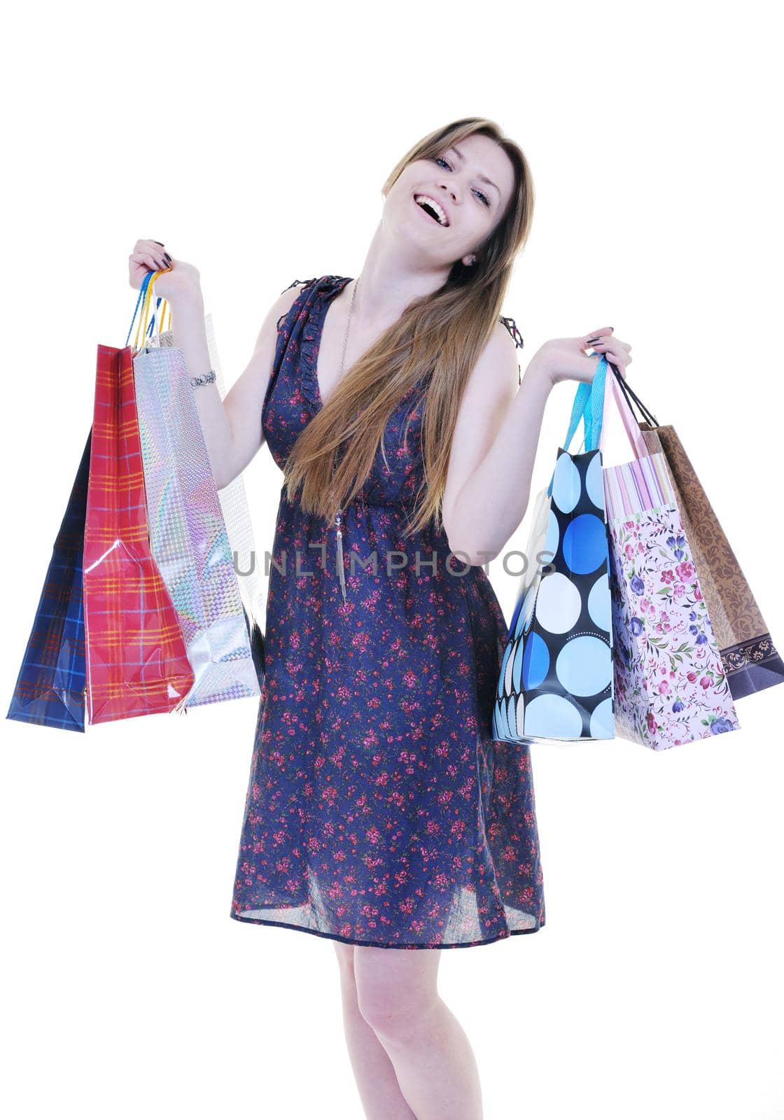happy young adult women  shopping with colored bags  isolated over white background in studio