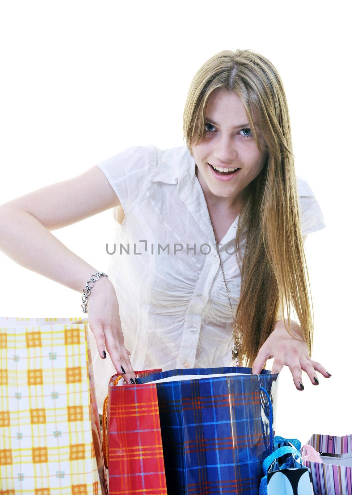 happy young adult women  shopping with colored bags  isolated over white background in studio