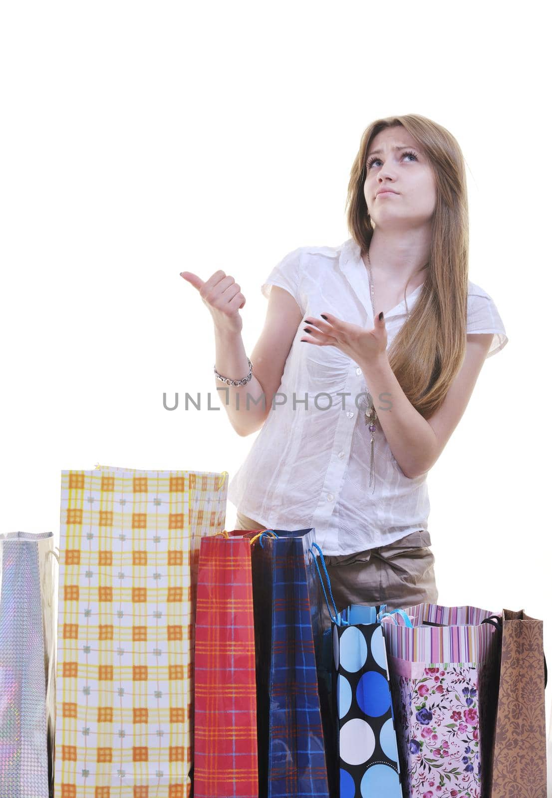 happy young adult women  shopping with colored bags  isolated over white background in studio