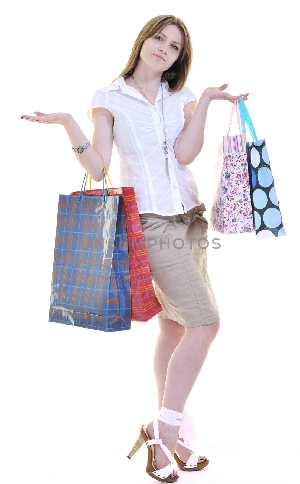 happy young adult women  shopping with colored bags  isolated over white background in studio
