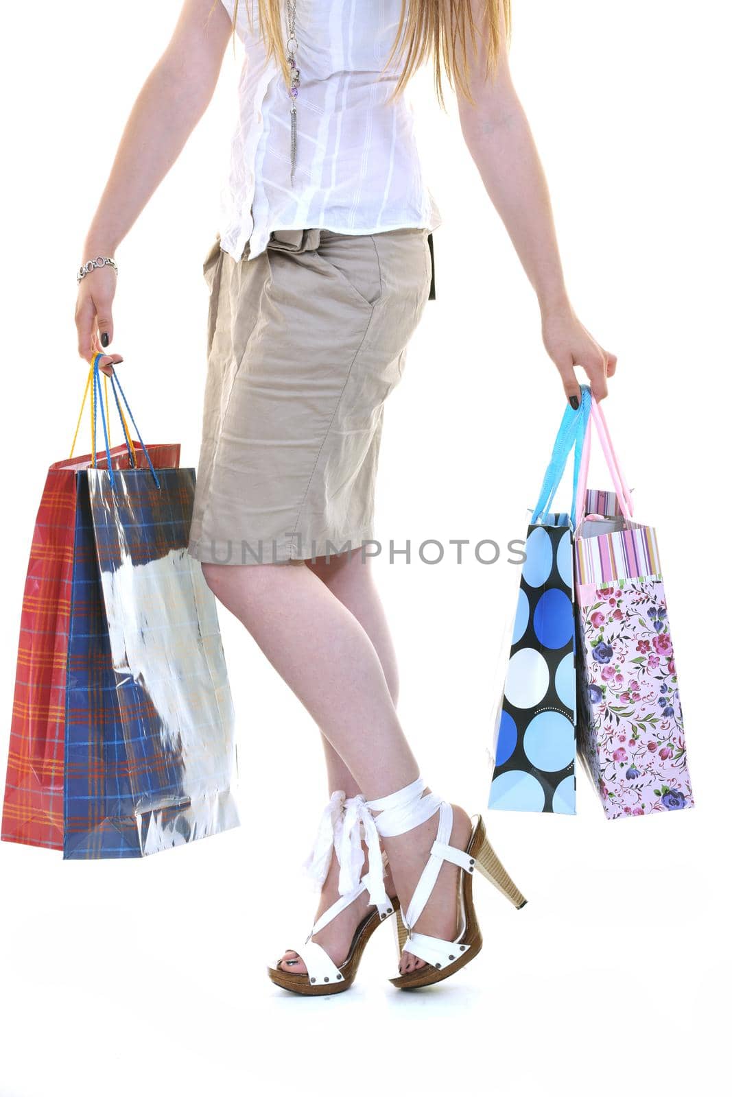 happy young adult women  shopping with colored bags  isolated over white background in studio