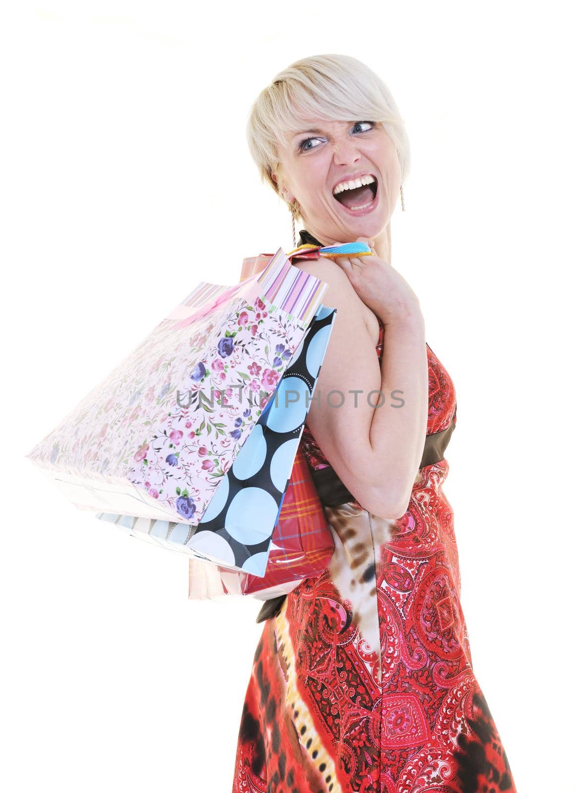 happy young adult women  shopping with colored bags  isolated over white background in studio