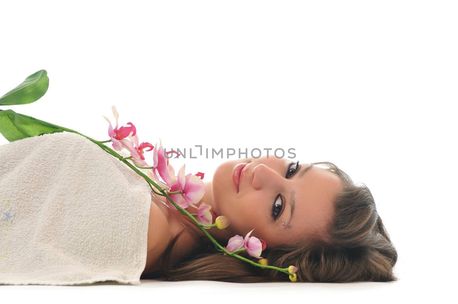 beauty halth and spa wellness isolated young woman face portrait closeup with towel and flower treatment