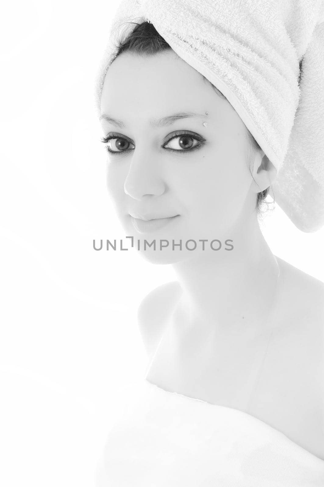 beauty halth and spa wellness isolated young woman face portrait closeup with towel and flower treatment