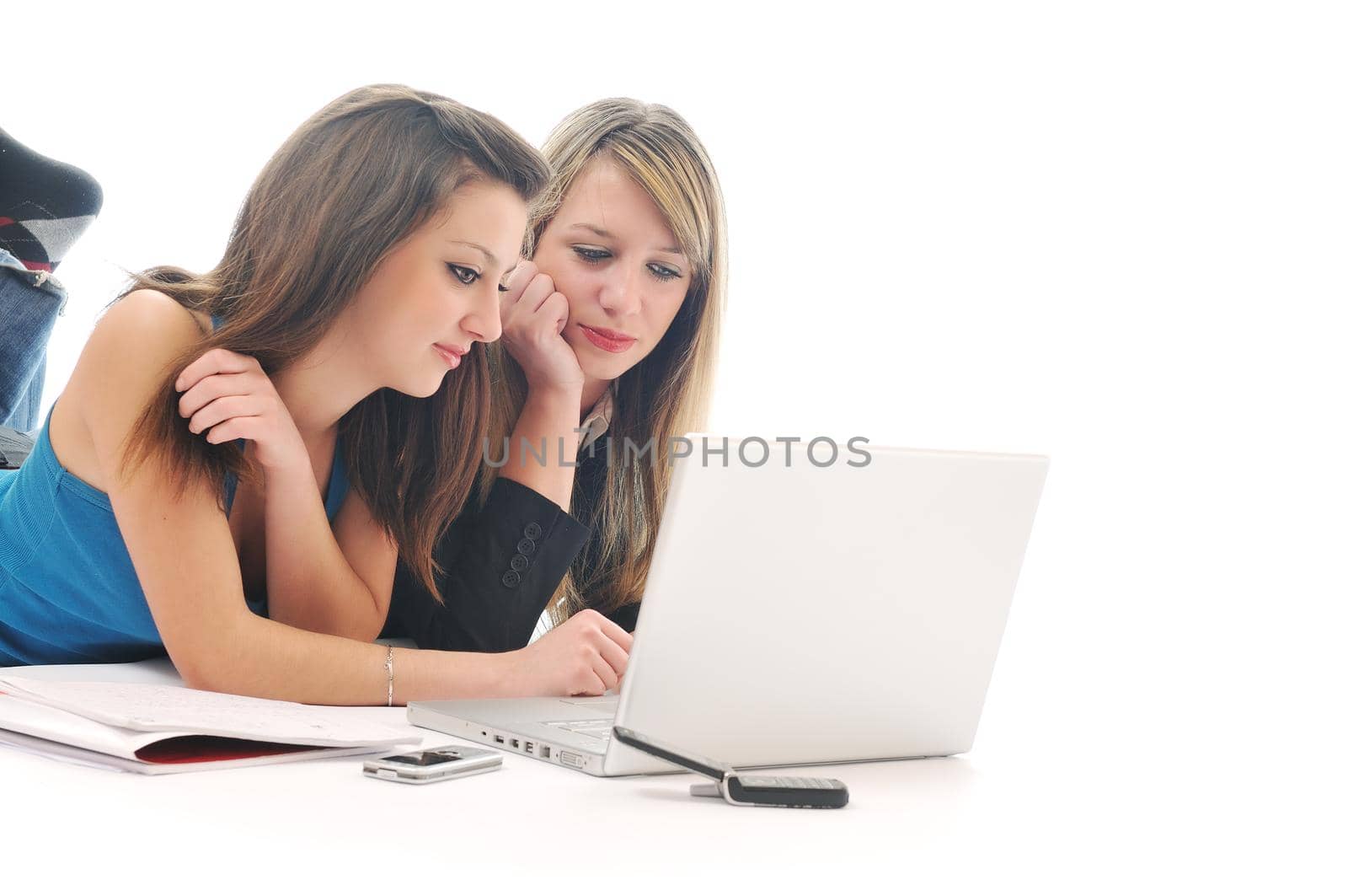 successful team two young happy  student girl work on laptop computer isolated on white