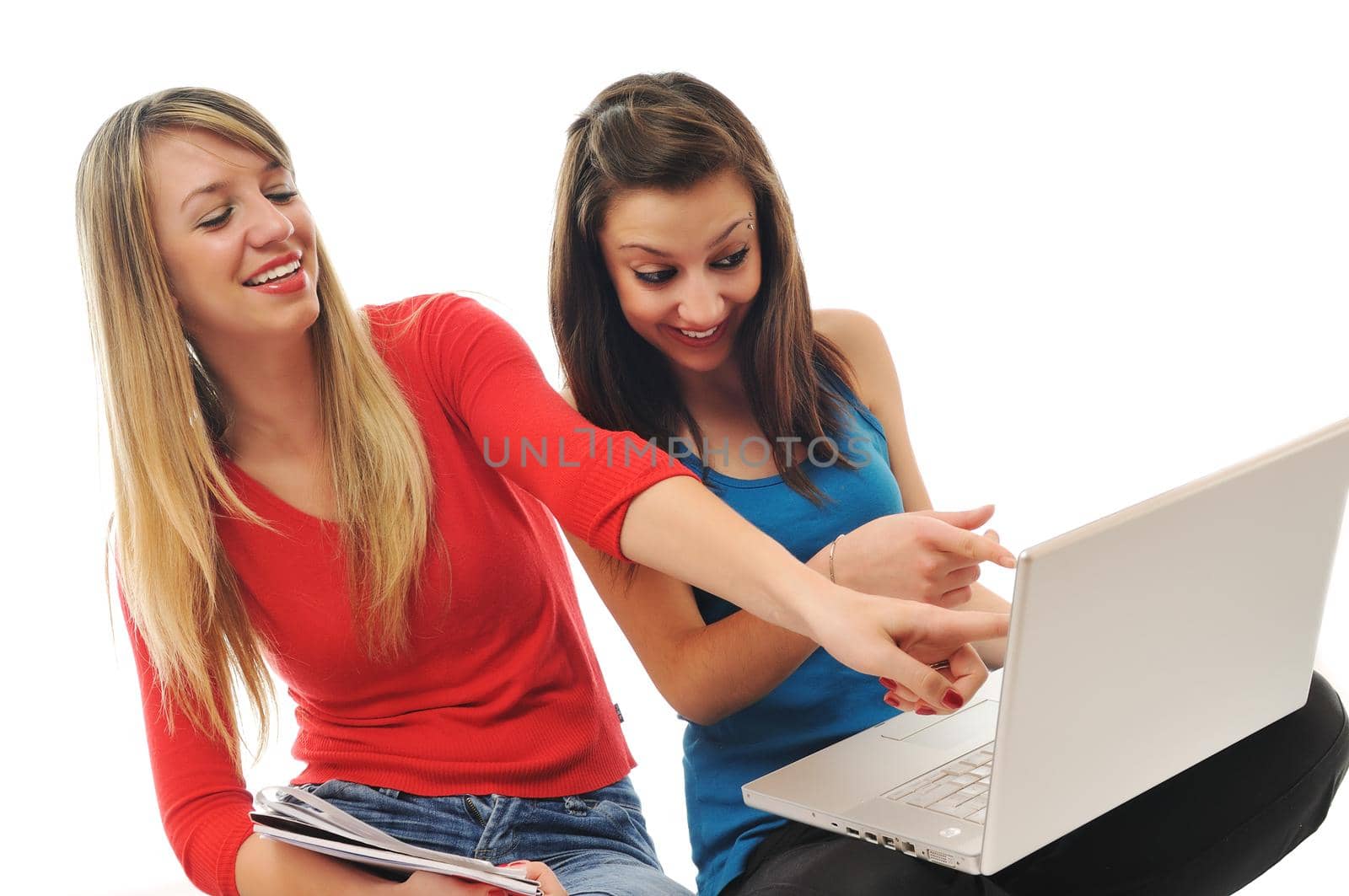 successful team two young happy  student girl work on laptop computer isolated on white