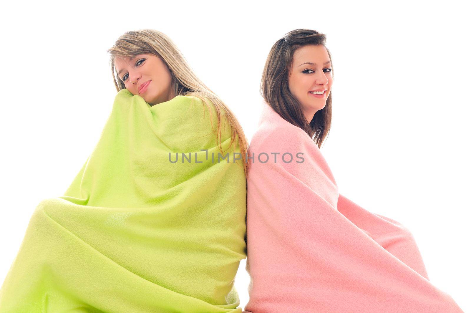 two youg happy giril woman smiling unger blanket isolated representing concept of lesbian love, happynes and softnes