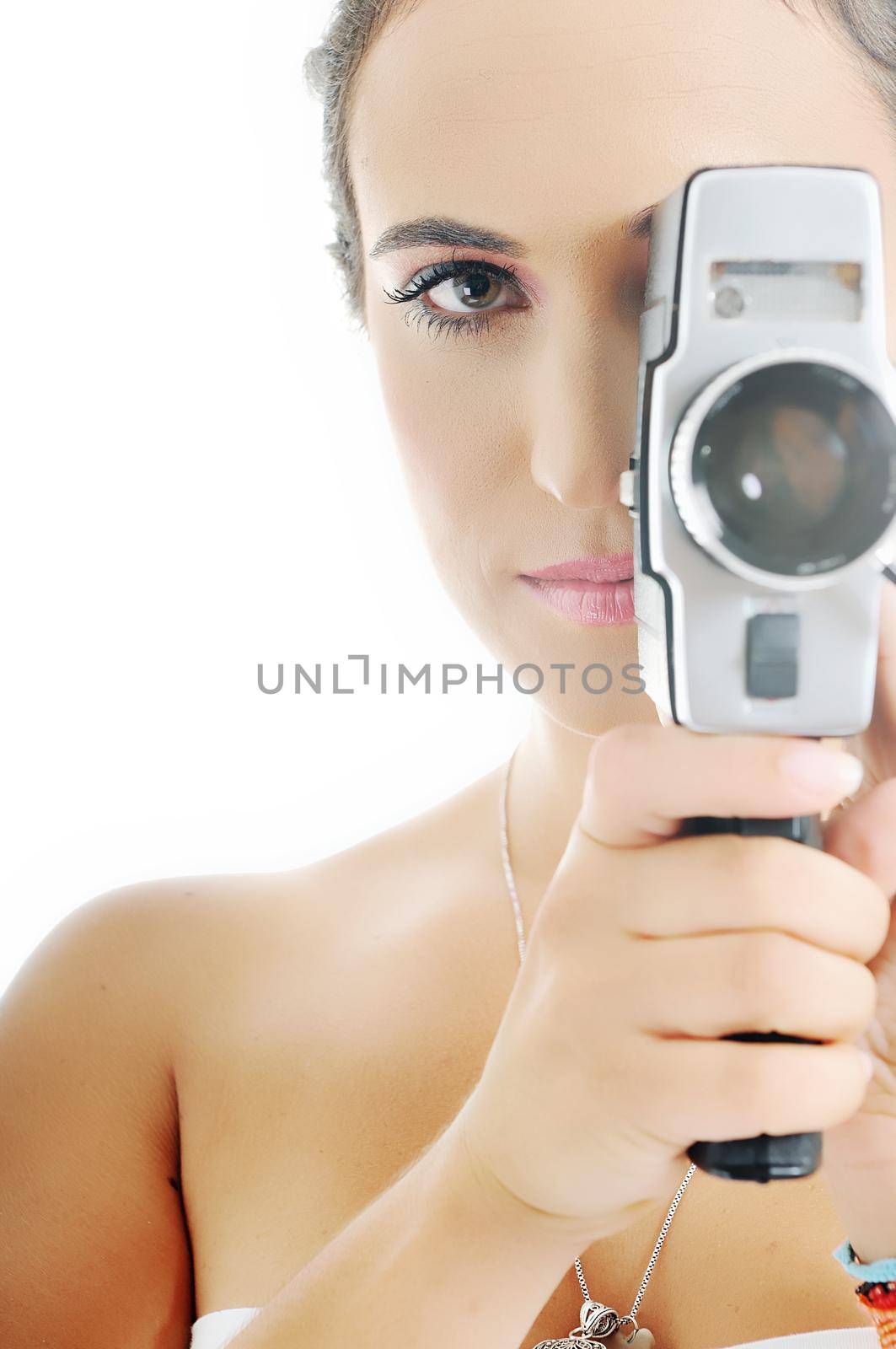 young beautiful woman face closeup with old fashion film camera