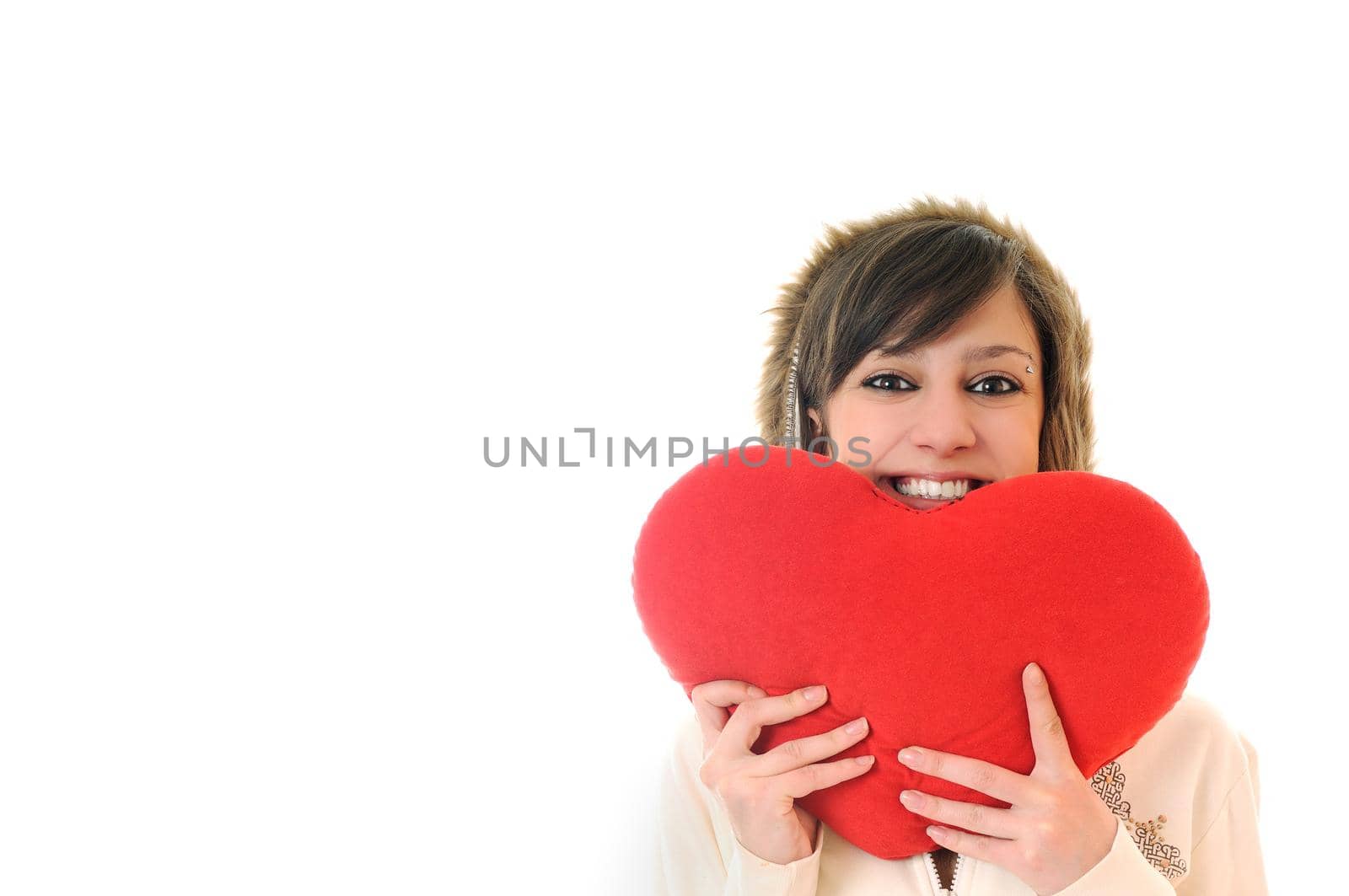 happy young woman with heart isolated on white