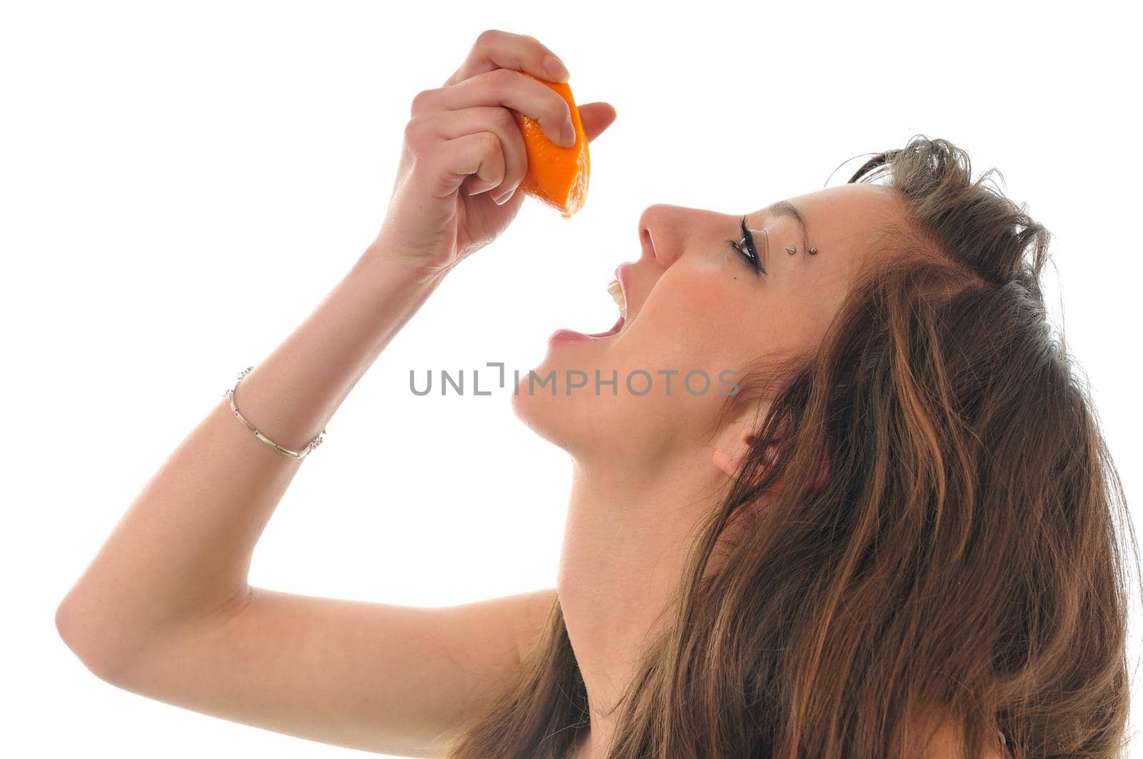 young woman orange isolated fruit food