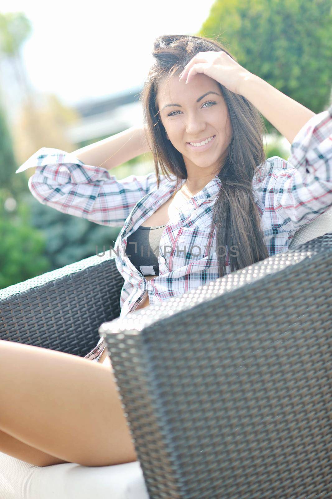beautiful young woman lady posing in green moden outdoor garden