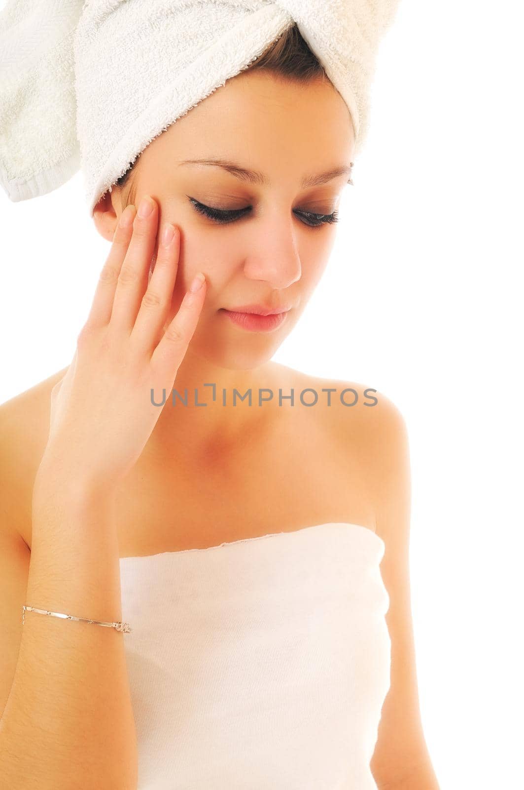 beauty halth and spa wellness isolated young woman face portrait closeup with towel and flower treatment