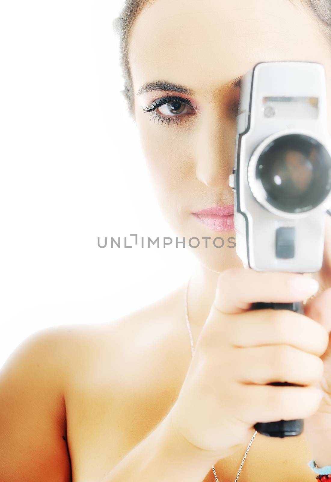 young beautiful woman face closeup with old fashion film camera