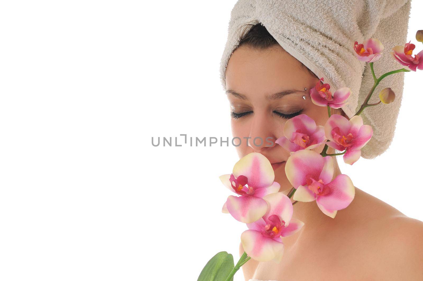 beauty halth and spa wellness isolated young woman face portrait closeup with towel and flower treatment