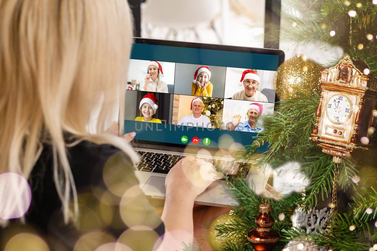 Attractive happy young girl student having video chat, waving. christmas.