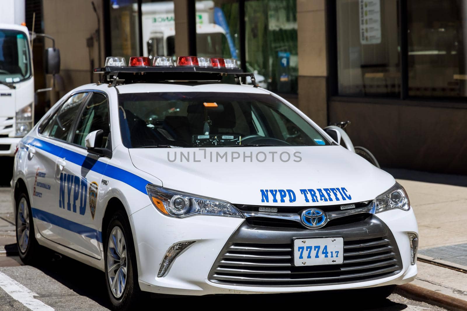 New York City NYPD Police car with sirens at day on street by ungvar