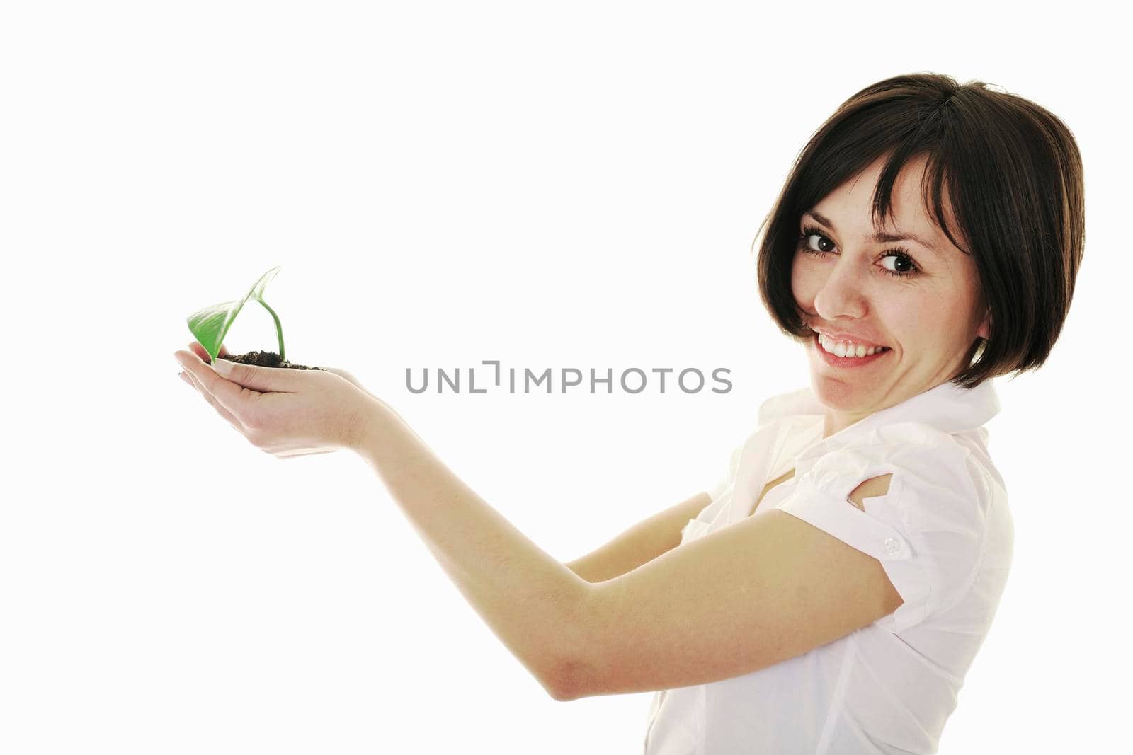 young business woman isolated on white holding green plant with small leaf and waiting to grow