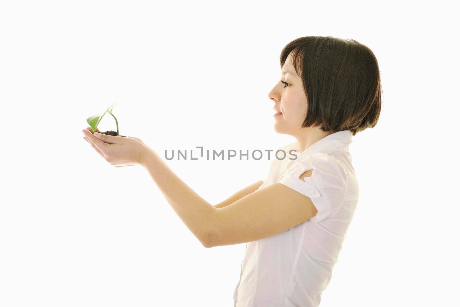 young business woman isolated on white holding green plant with small leaf and waiting to grow
