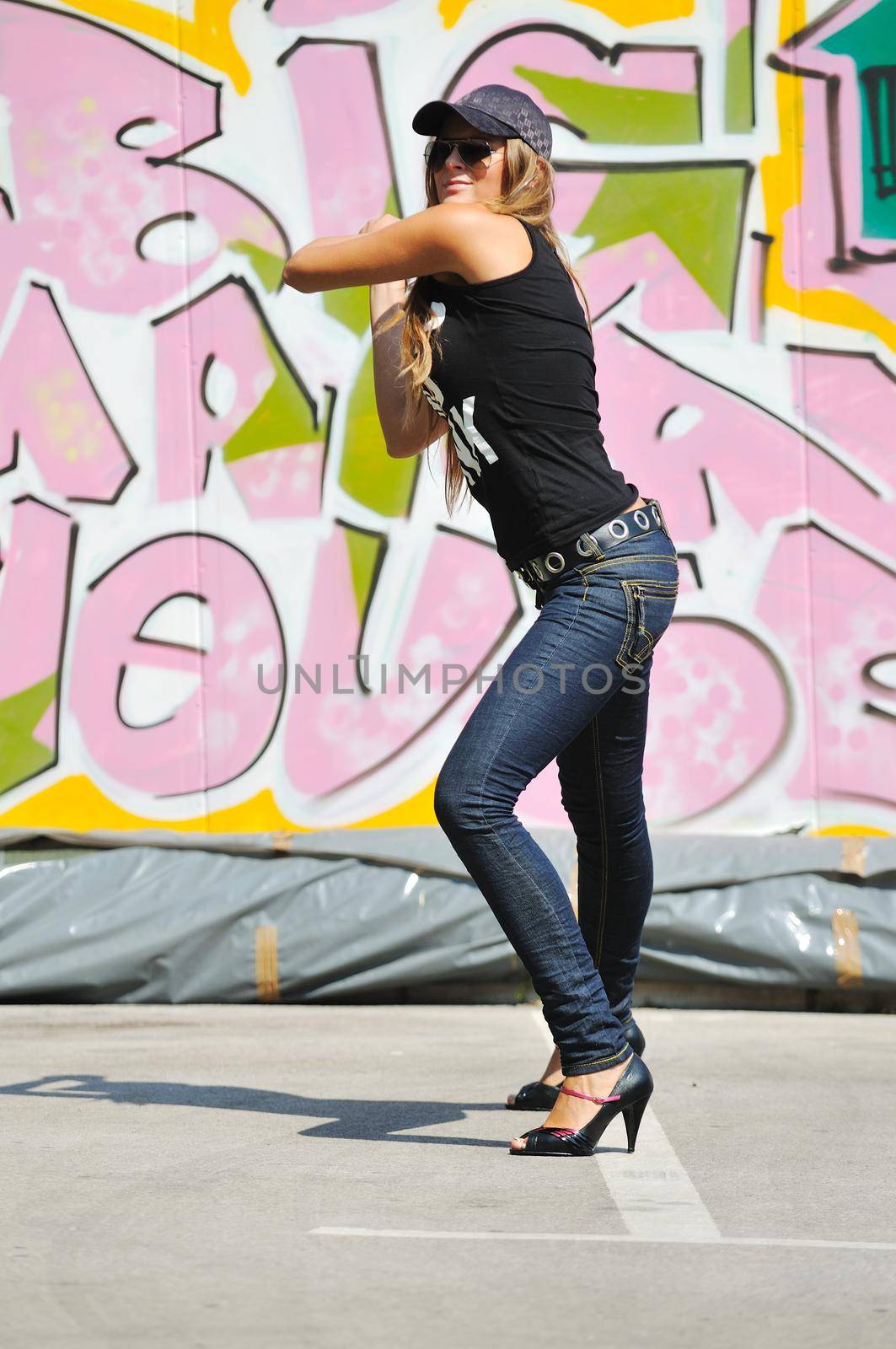 young pretty urban modern fashion woman pose outdoor on street