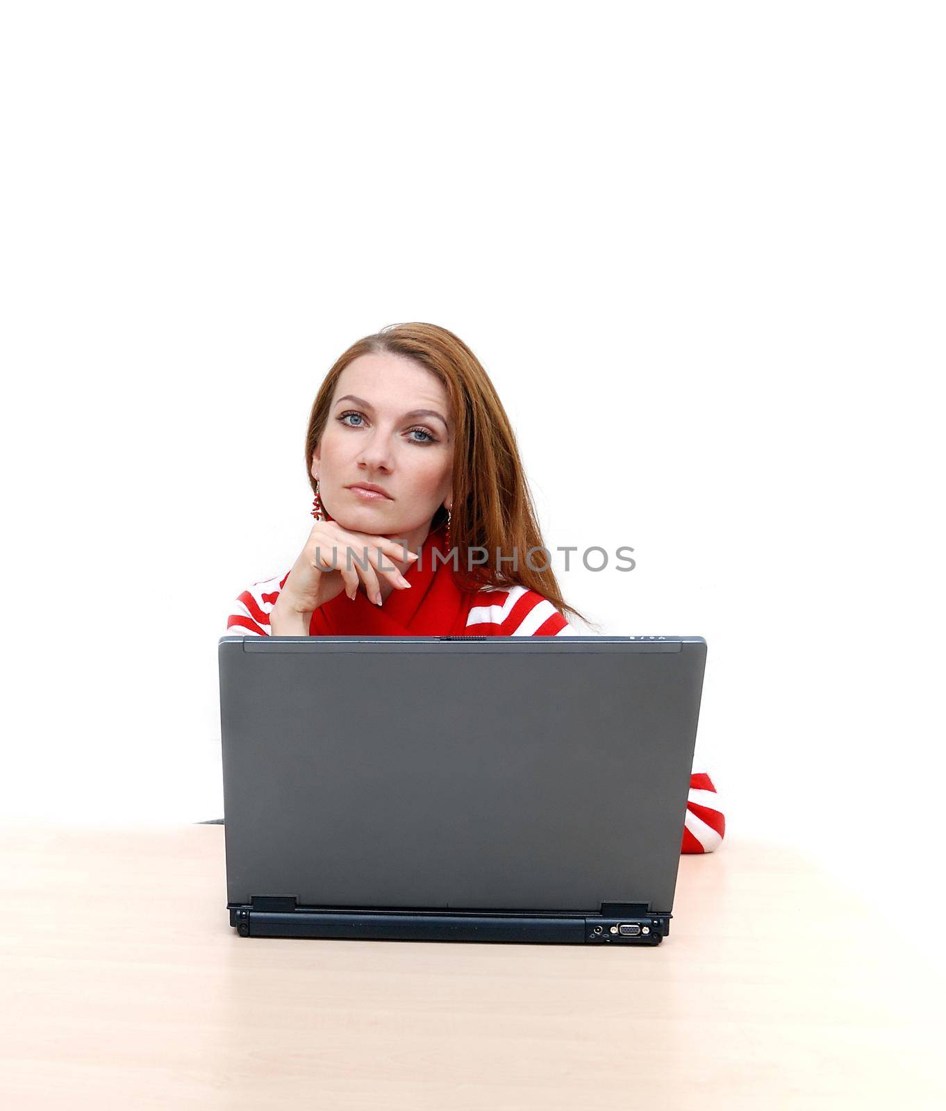 woman in red working on laptop at bright  office