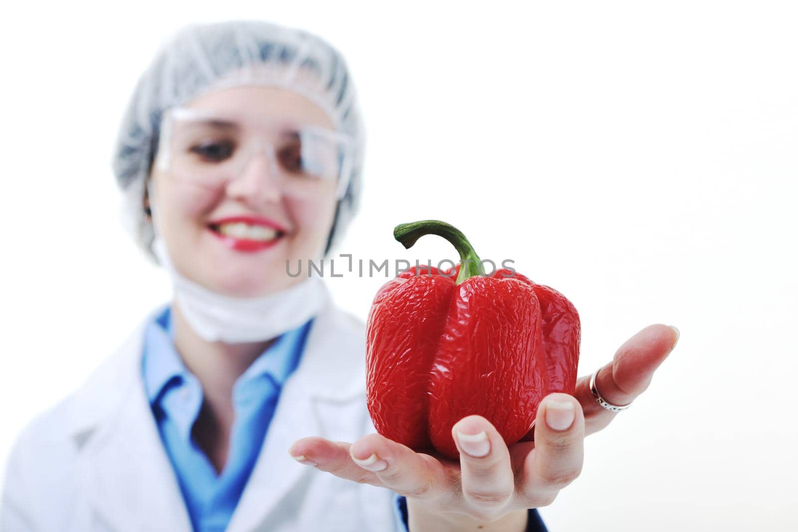 isolated on white young nurse doctor woman with red vegetable food papper representing bio food concept 