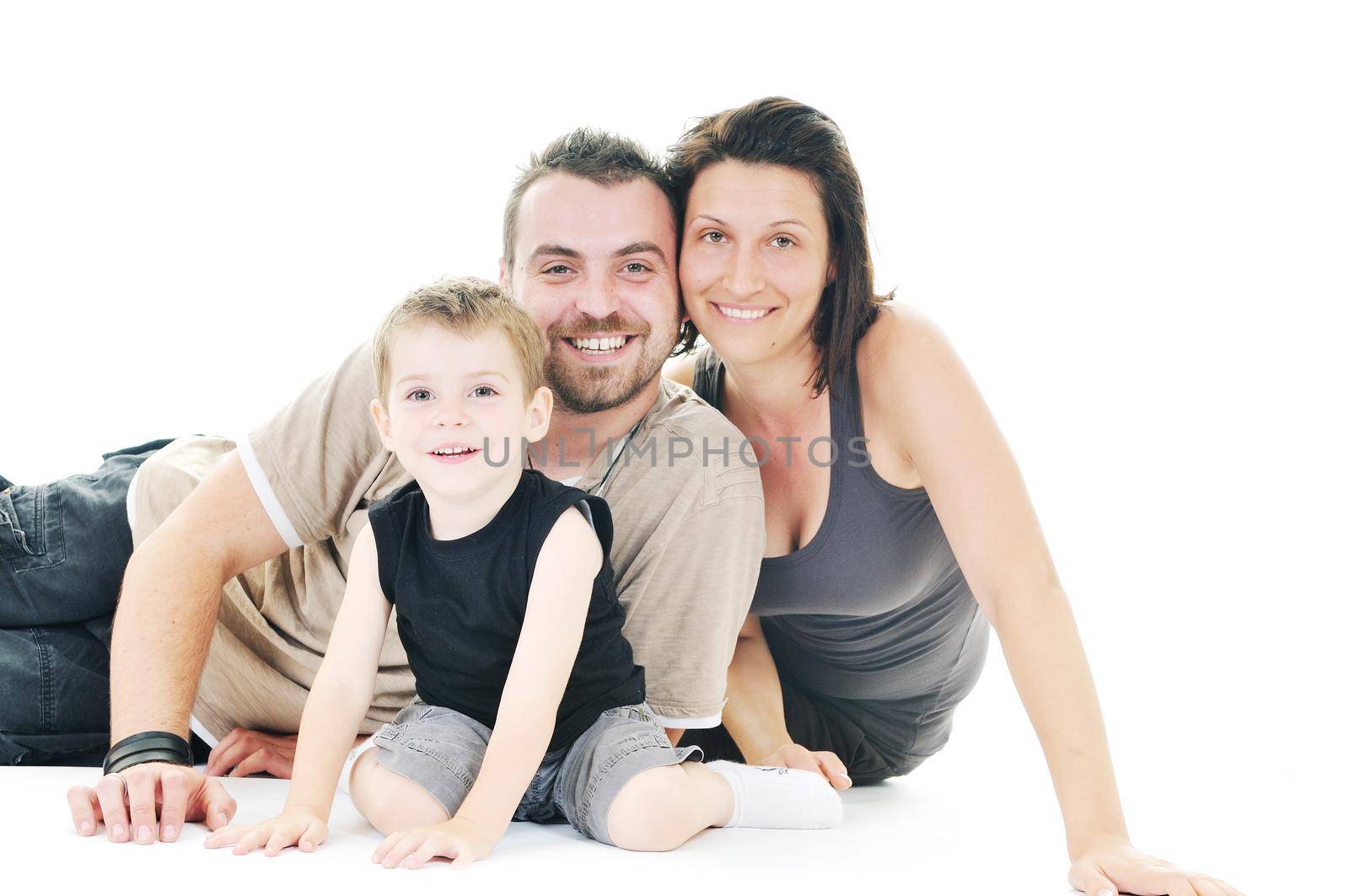 happy young family isolated on white by dotshock